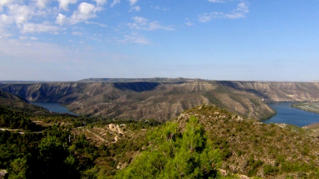 The awesome tossals d almatret escarpment with the river ebro winding through it