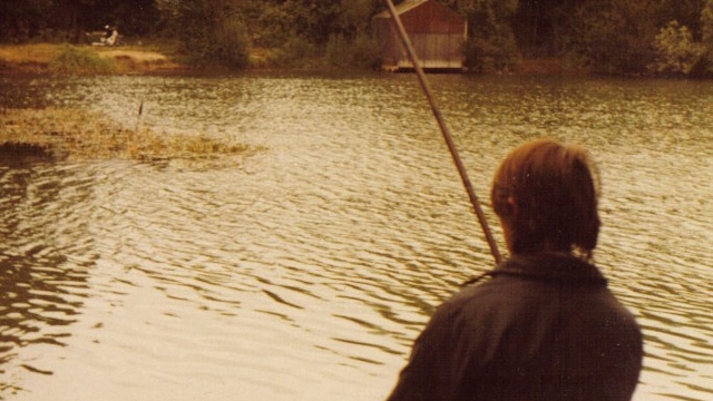 Fishing for the big rudd at todds 1980 and the old boathouse in the background with my then transport a honda 50 (in camo green!)