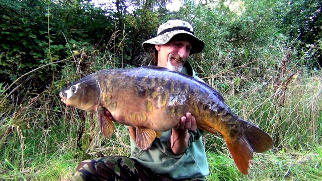 A really wonderful old scaly carp from the woolpacks lake 8 at 23lb that i had to go out in the boat for, and it was well worth it!